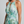 Vestido Noelia · Maxi floral plisado de cuello halter