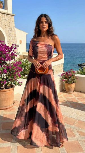 Vestido Carmina · Largo con estampado naranja y marrón