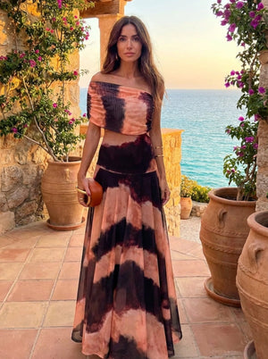 Vestido Carmina · Largo con estampado naranja y marrón