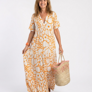 Vestido Estrella · Midi floral con escote en V